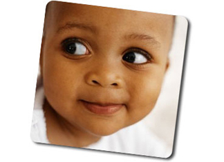 young girl with big eyes looking left