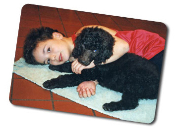 Andrew and pup cuddling on the floor