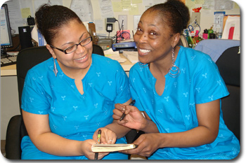 Francesca Dumont and Kisha Hope conferring