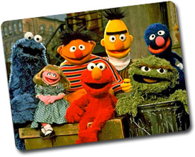 seven puppets AKA Muppets, posed for a picture